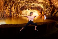 A woman practises yoga in the Saalfeld Fairy Grottoes